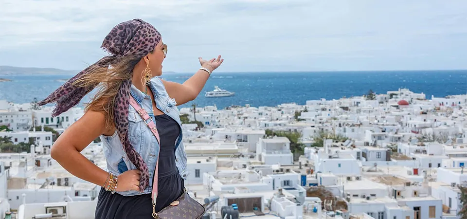 Woman enjoying weather in Greece in September